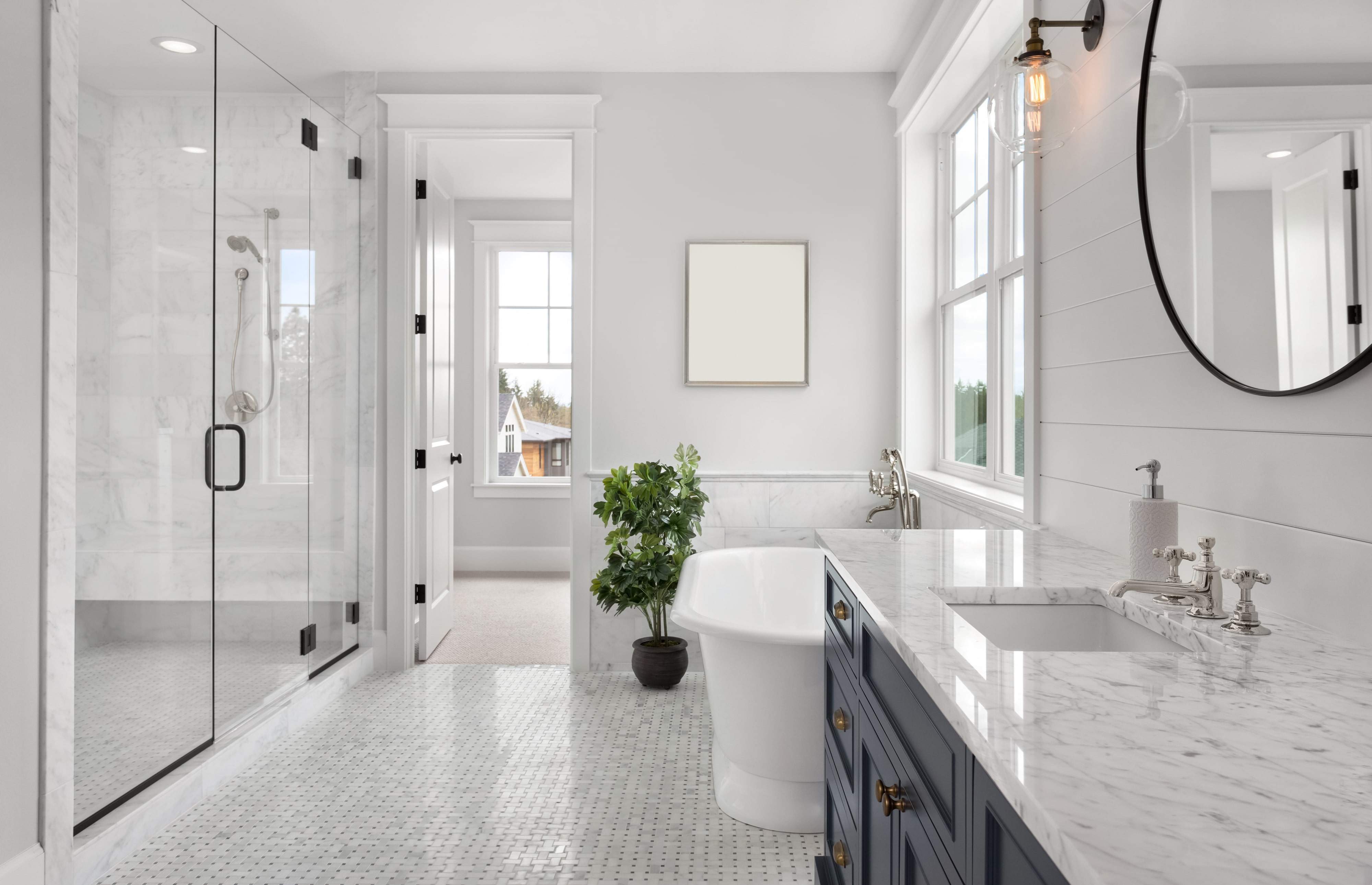 Beautiful bathroom with white tile floor and granite countertop